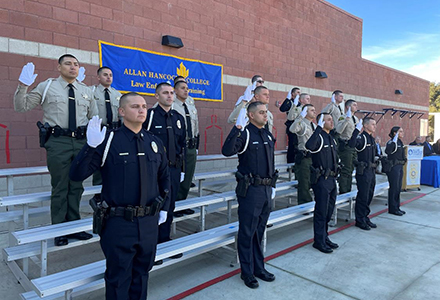 Eighteen recruits graduate from the Law Enforcement Academy.
